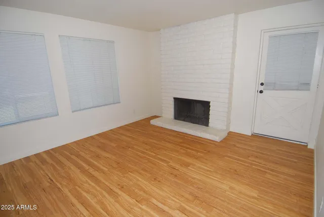 a bedroom with a bed and a ceiling fan