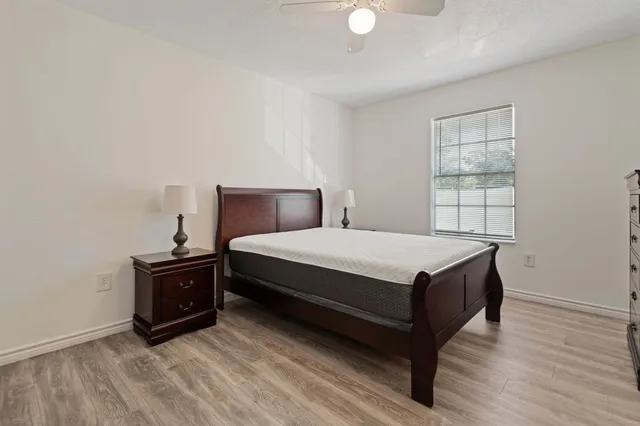 a bedroom with a bed and window