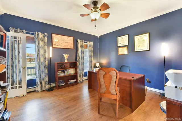 a work room with furniture and wooden floor