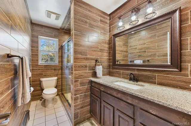 a view of a livingroom with furniture and staircase