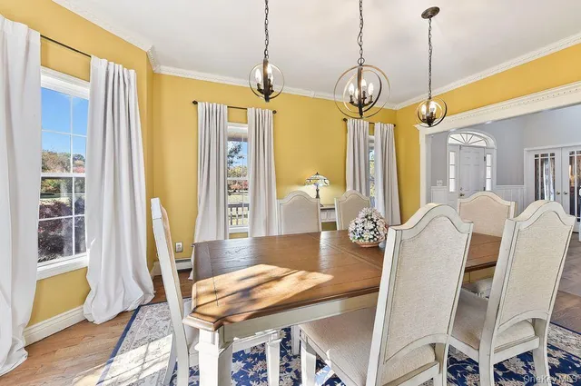 a dining room with furniture and window