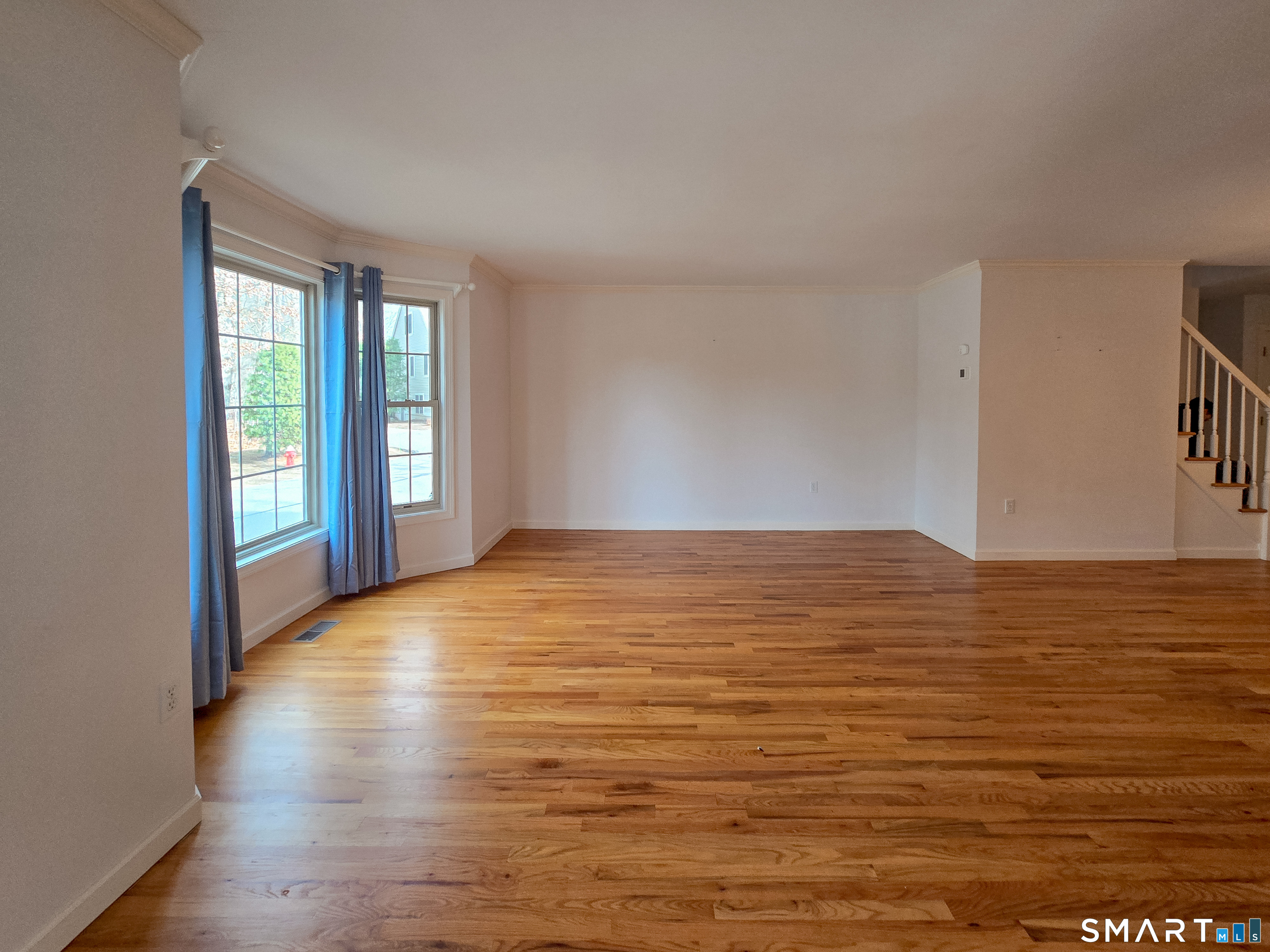 1 Bittersweet Lane, Unit 1 East Lyme, CT 06357 - Photo 11 of 35 a view of empty room with wooden floor