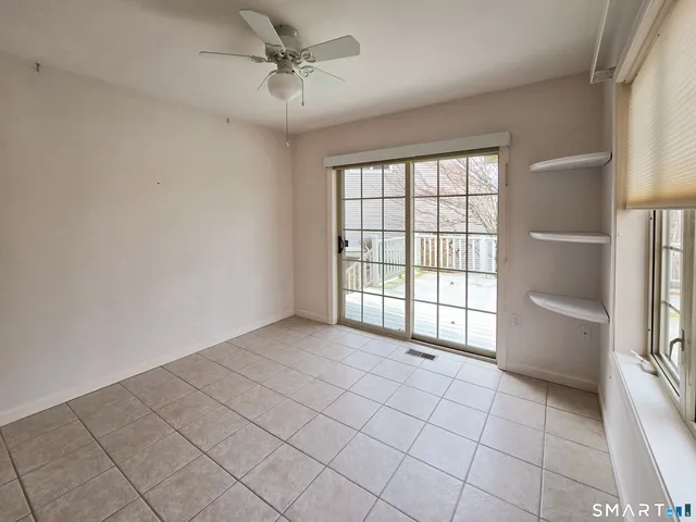 a view of room with furniture and windows