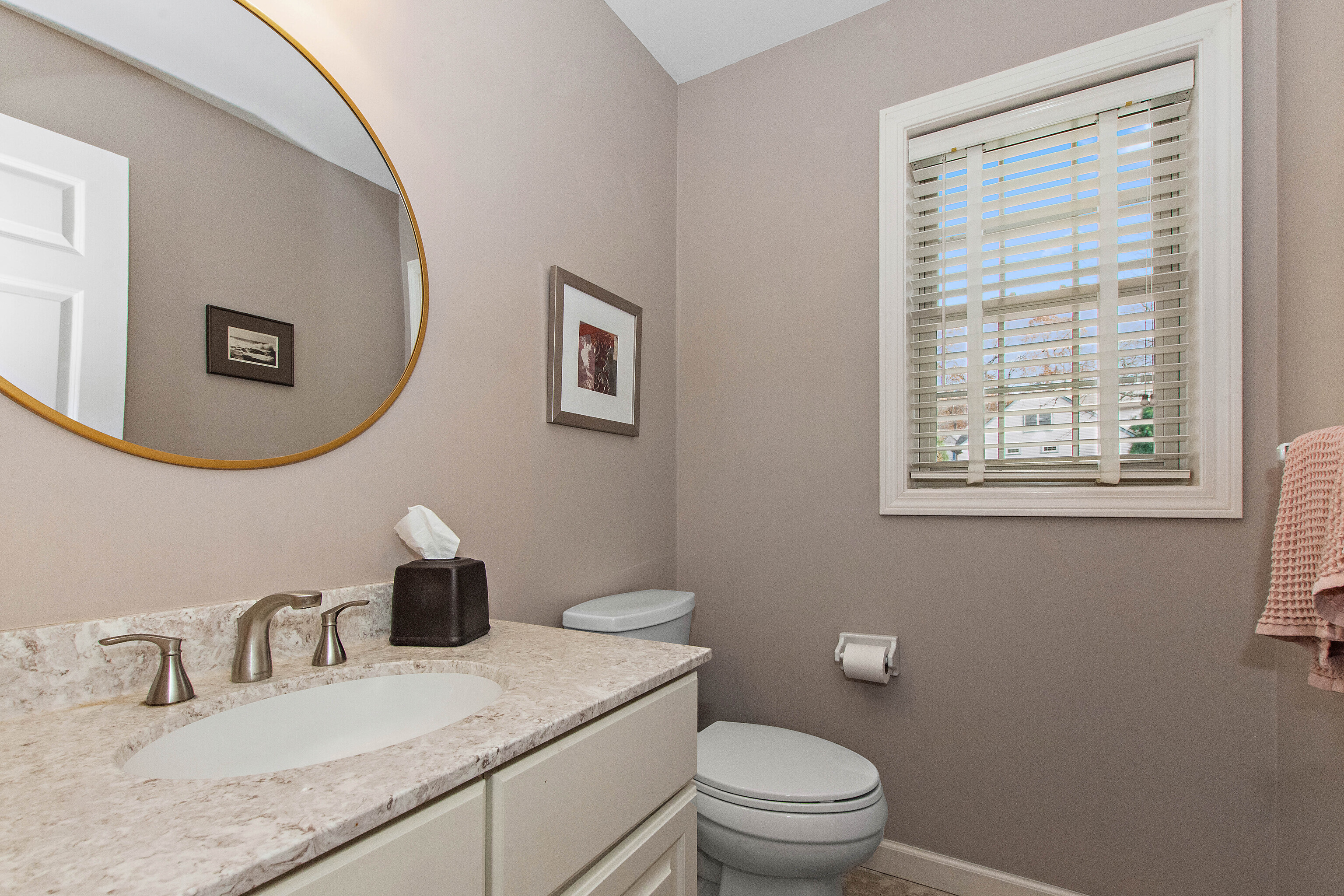 1 Bittersweet Lane, Unit 1 East Lyme, CT 06357 - Photo 21 of 35 a bathroom with a granite countertop toilet a sink and a mirror
