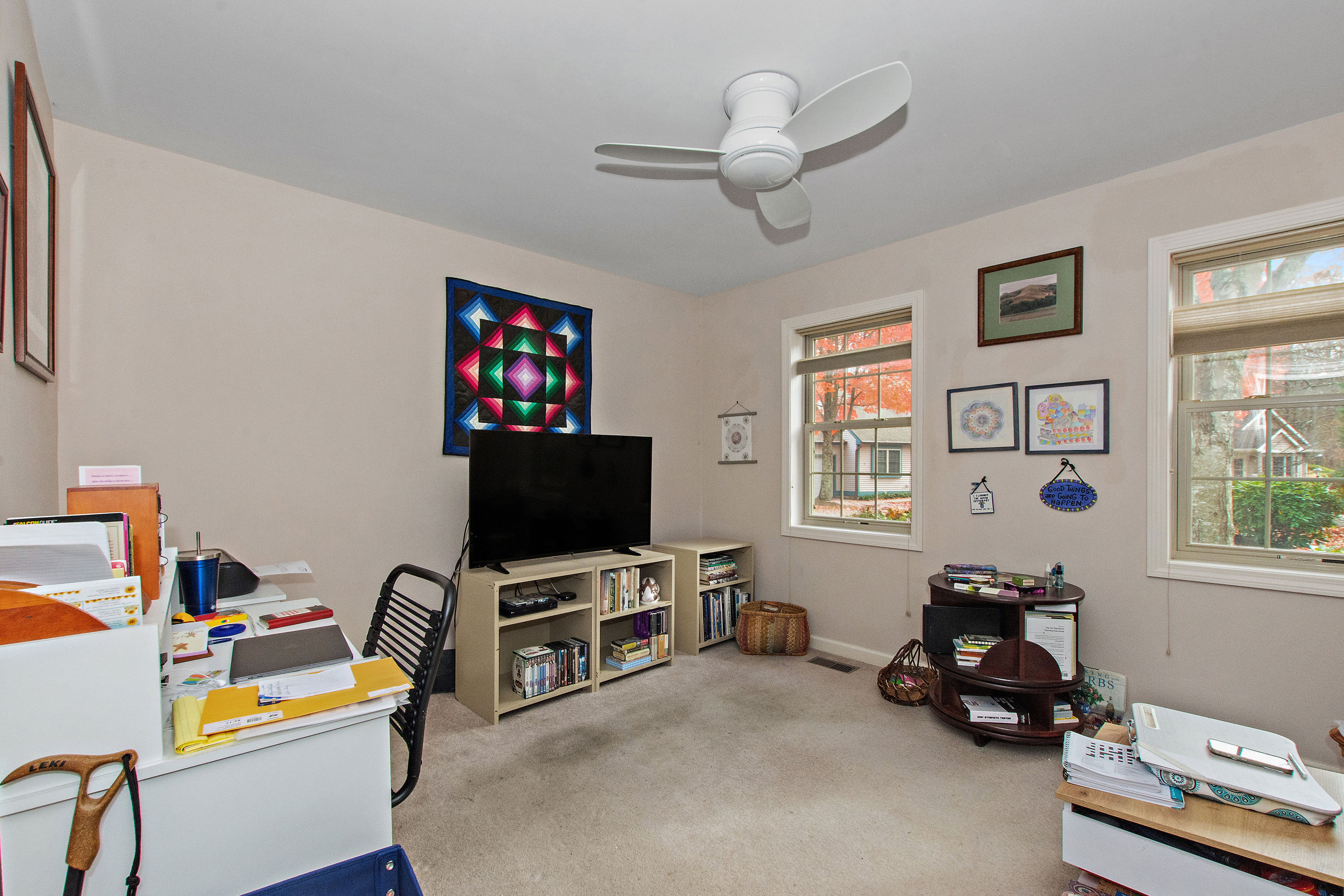 1 Bittersweet Lane, Unit 1 East Lyme, CT 06357 - Photo 22 of 35 a room with furniture and a flat screen tv