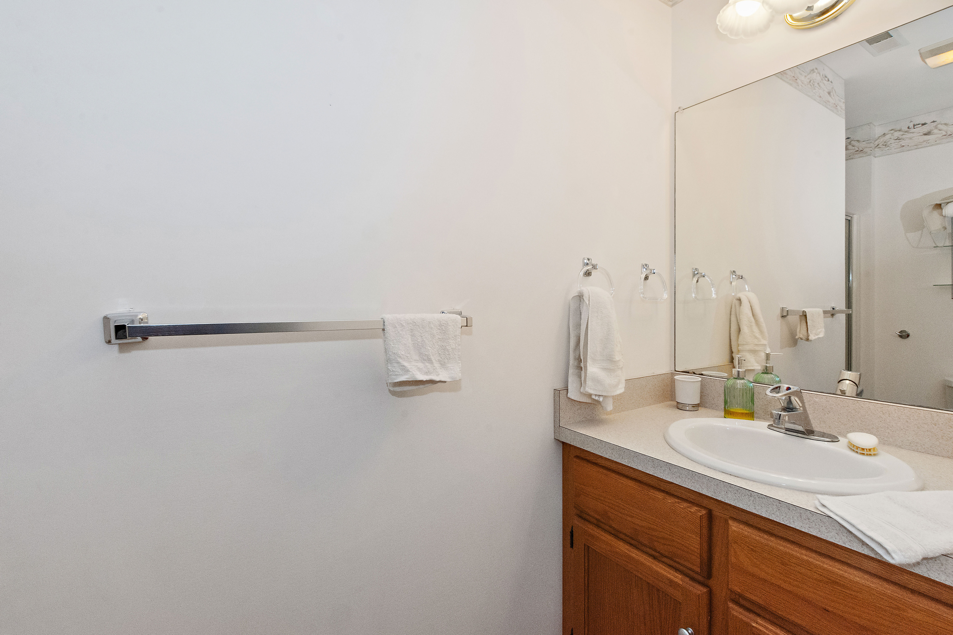 1 Bittersweet Lane, Unit 1 East Lyme, CT 06357 - Photo 28 of 35 a bathroom with a sink and a mirror