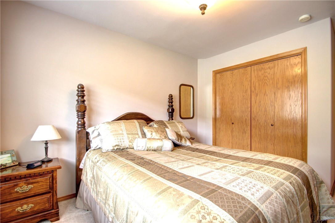 18898 Cascade Ridge Court Mount Vernon, WA 98274 - Photo 22 of 25 a bedroom with a bed and a lamp on table