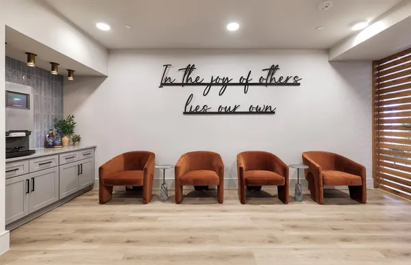 a view of a room with furniture and windows