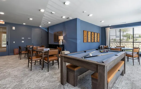 a view of a a dining room with furniture window and outside view