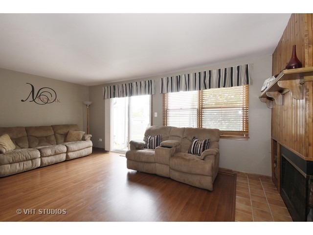 719 South Raven Road Shorewood, IL 60404 - Photo 4 of 11 a living room with furniture and a window