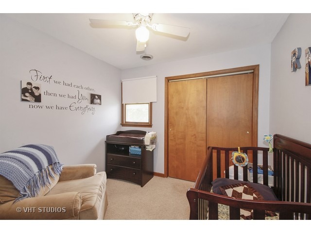 719 South Raven Road Shorewood, IL 60404 - Photo 8 of 11 a bedroom with furniture and wooden floor
