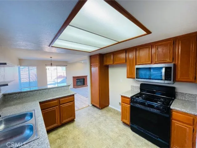 a view of livingroom with hardwood floor and a ceiling fan