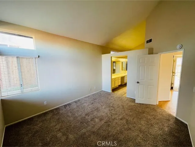 an empty room with a empty space and a window