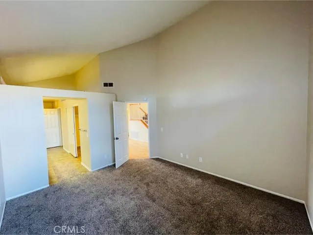 a spacious bathroom with double vanity and mirrors