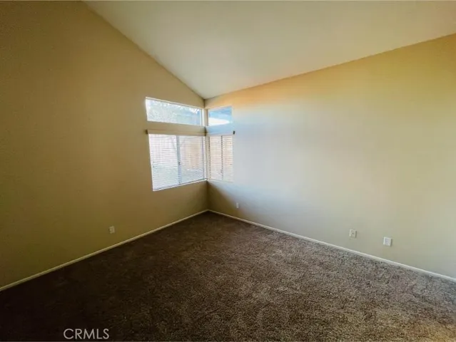 a bathroom with double vanity sinks and a large mirror