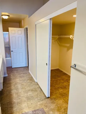 a bathroom with a granite countertop shower and a toilet