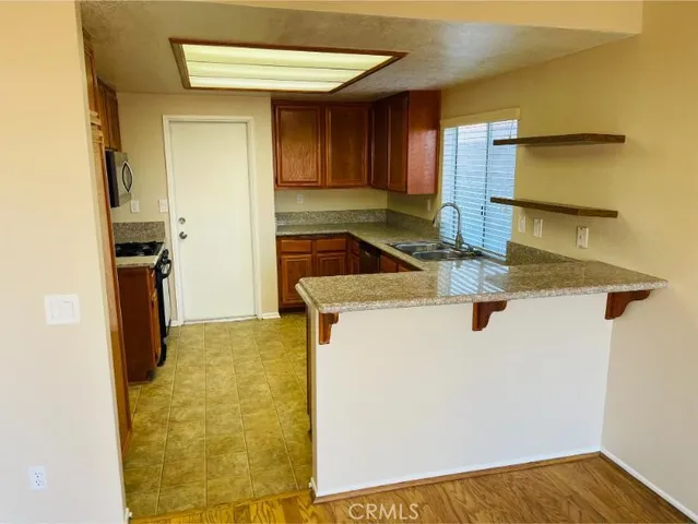 a kitchen with a stove and a refrigerator