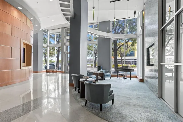 a room with pool table and windows