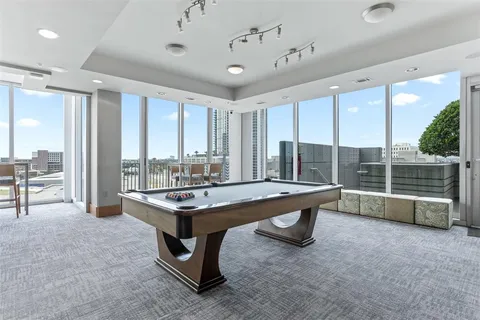 a kitchen with sink a refrigerator and cabinets
