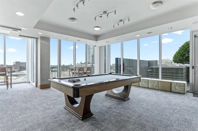 a kitchen with sink a refrigerator and cabinets