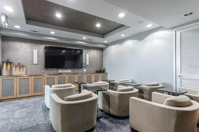 a view of a room with gym equipment and a large window