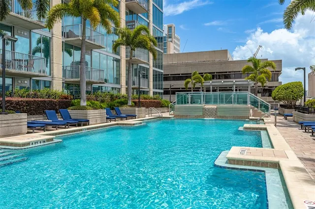 a view of a patio with couches and potted plants