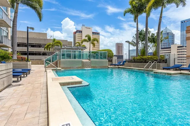 a view of a terrace from a dining room with furniture