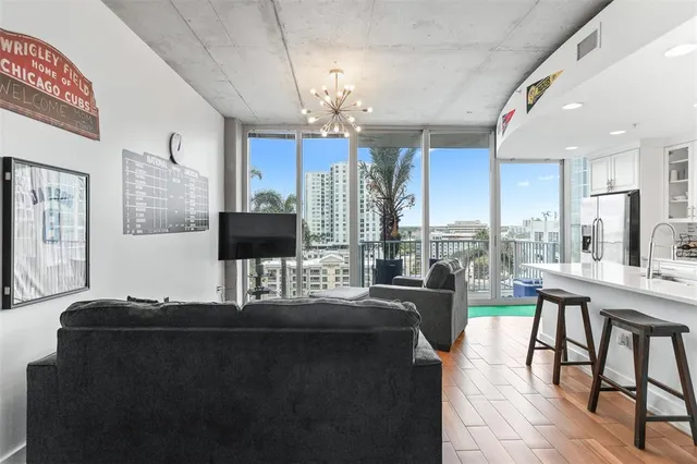 a living room with fireplace furniture and a flat screen tv