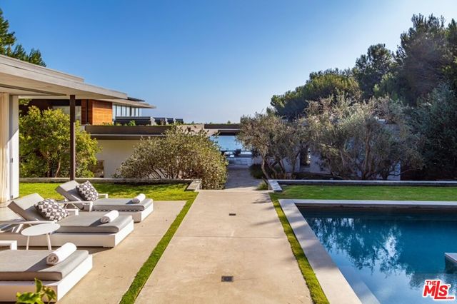 a view of swimming pool with a patio