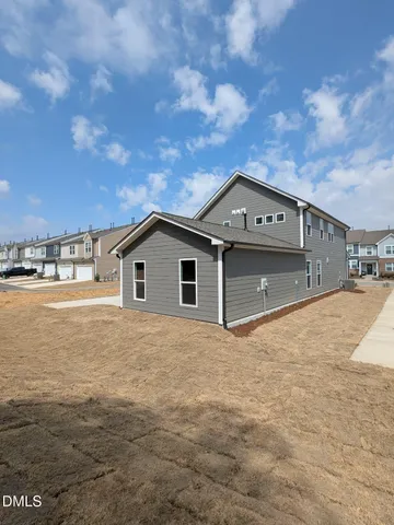 a kitchen with stainless steel appliances granite countertop wooden floors wooden cabinets and sink