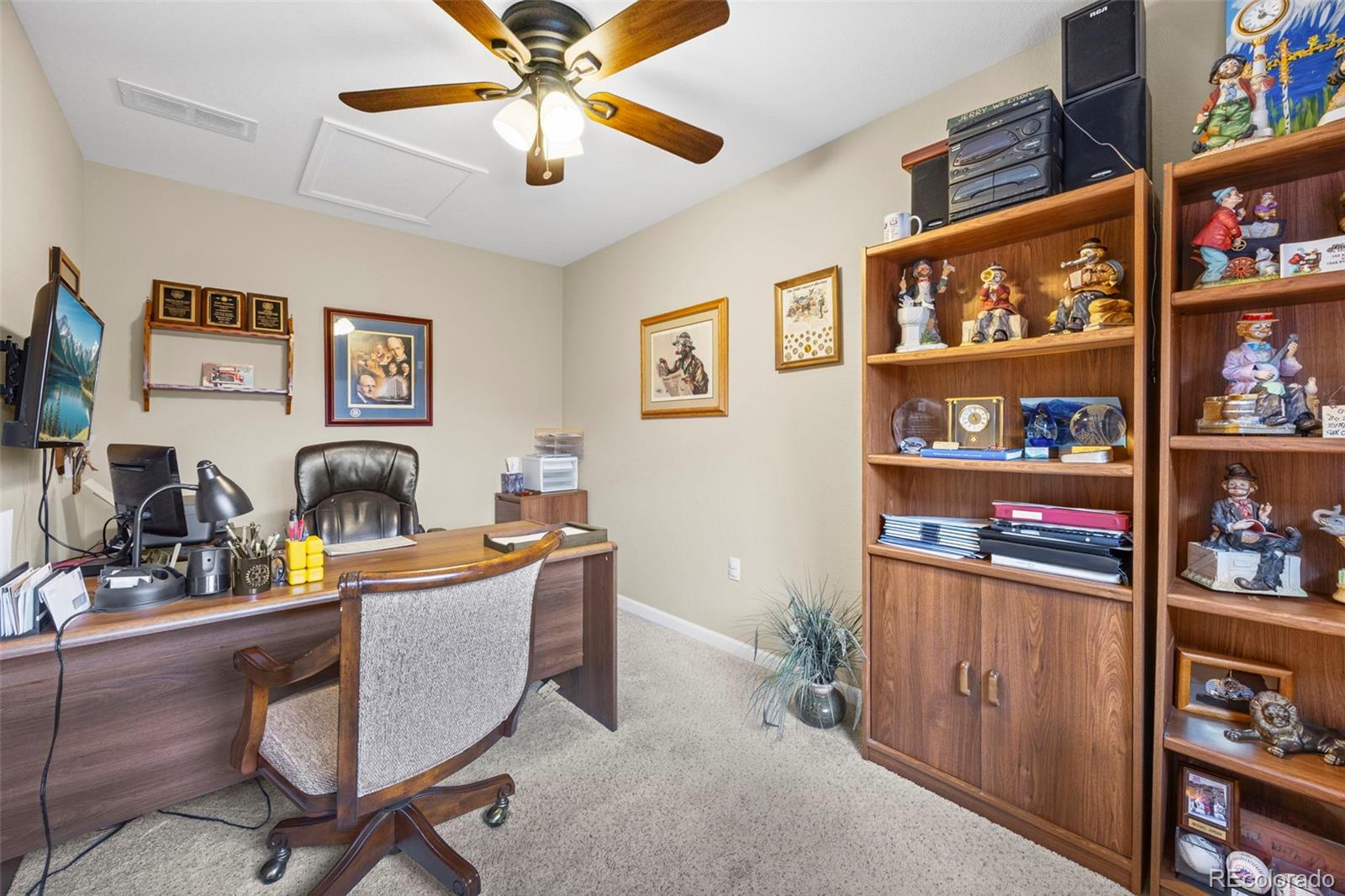8615 Gold Peak Place, Unit F Highlands Ranch, CO 80130 - Photo 18 of 39 a work room with furniture and book shelf