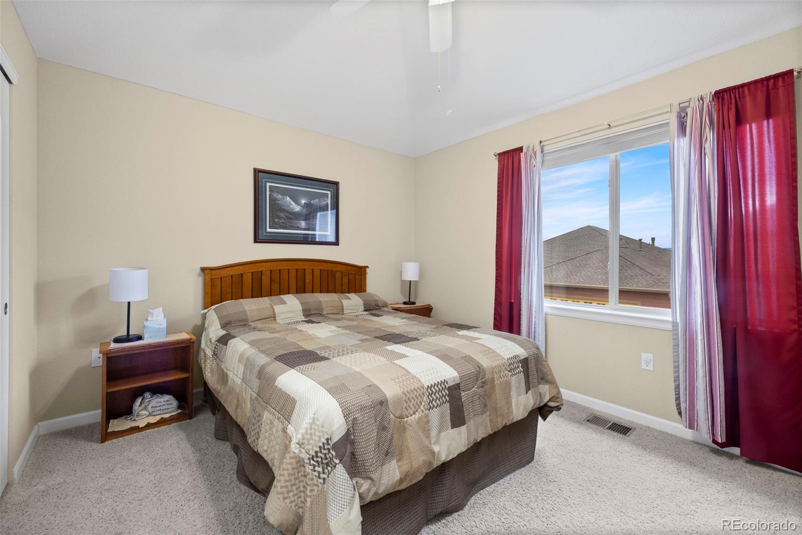 8615 Gold Peak Place, Unit F Highlands Ranch, CO 80130 - Photo 19 of 39 a bedroom with a bed and a window