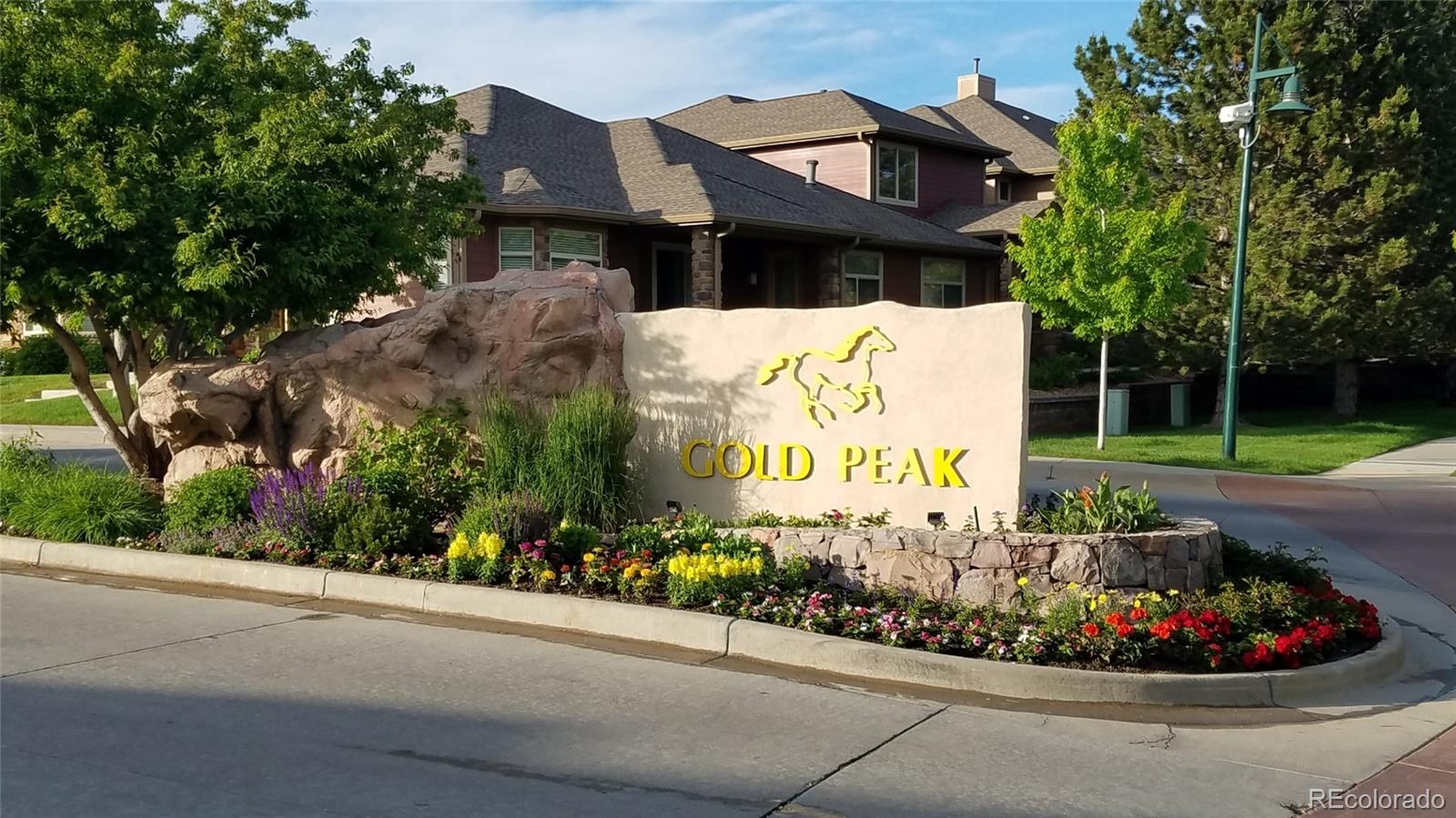 8615 Gold Peak Place, Unit F Highlands Ranch, CO 80130 - Photo 36 of 39 a sign on the side of the road
