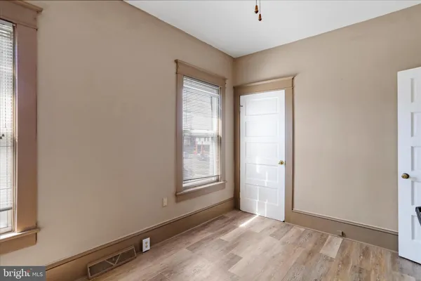 a bathroom with a tub sink and vanity