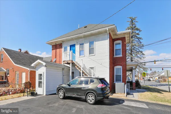 a car parked in front of a house