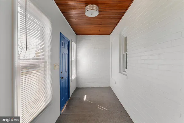 a view of hallway with windows