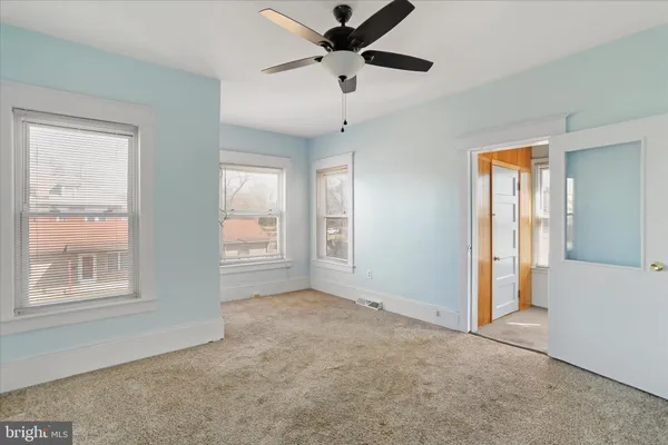 a view of an empty room with a window