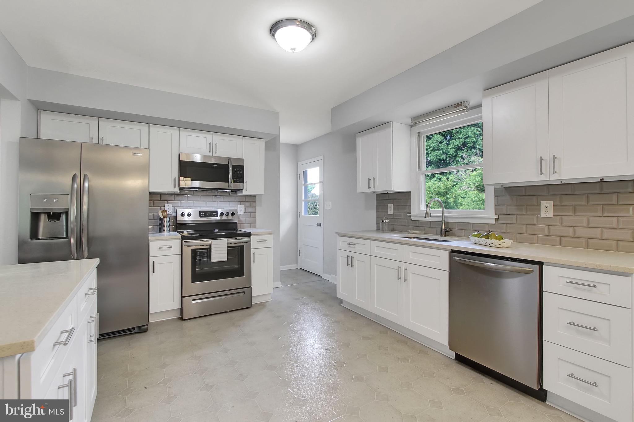1905 Angleside Road Fallston, MD 21047 - Photo 1 of 25 a kitchen with cabinets stainless steel appliances and window