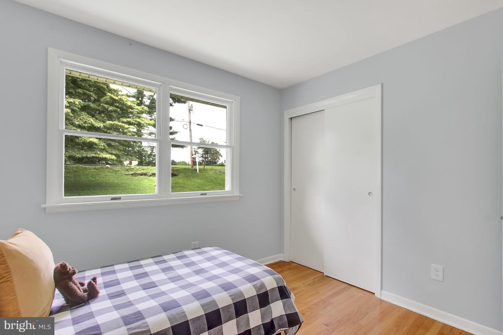 1905 Angleside Road Fallston, MD 21047 - Photo 14 of 25 a bedroom with a bed and wooden floor