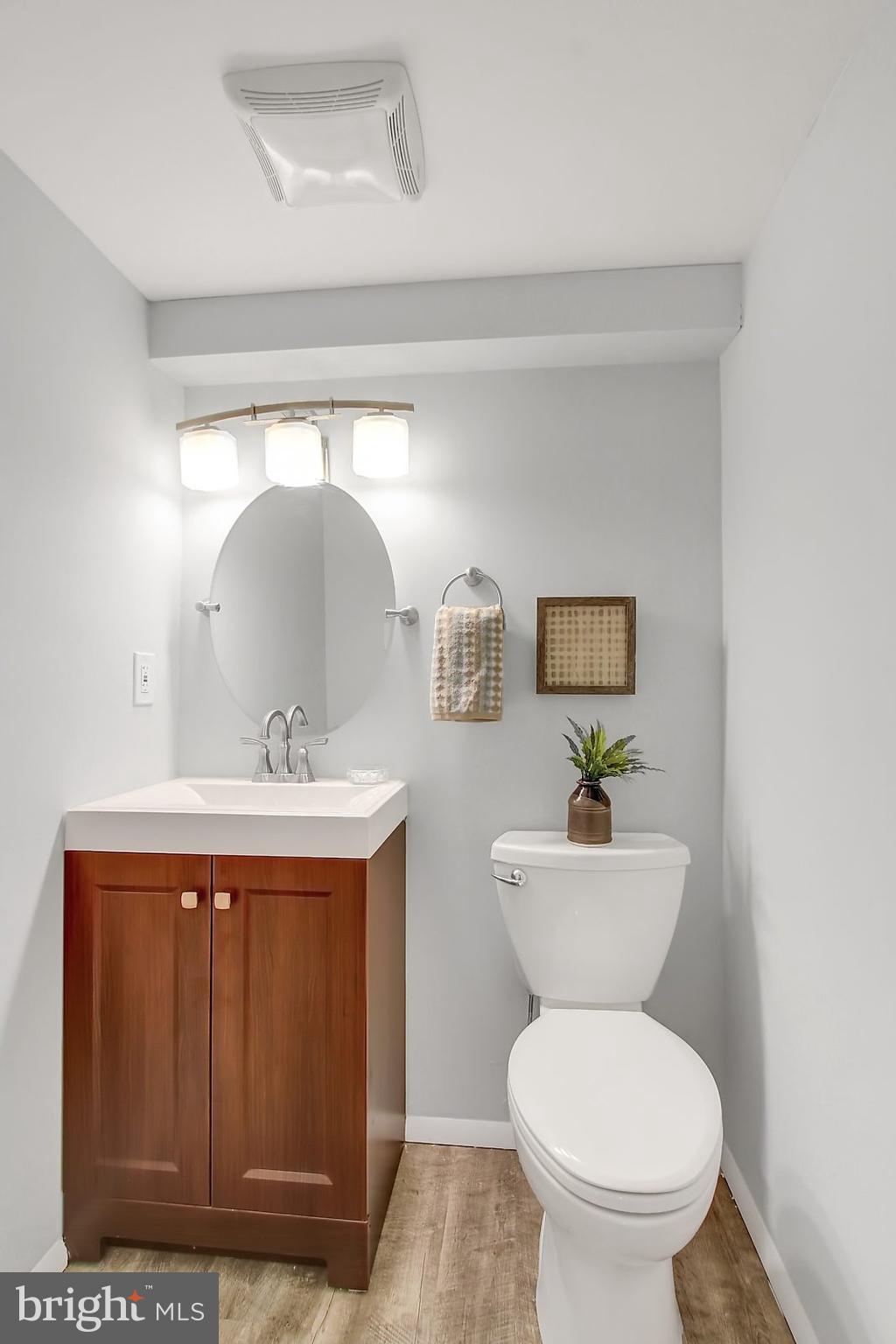 1905 Angleside Road Fallston, MD 21047 - Photo 20 of 25 a bathroom with a toilet a sink and mirror