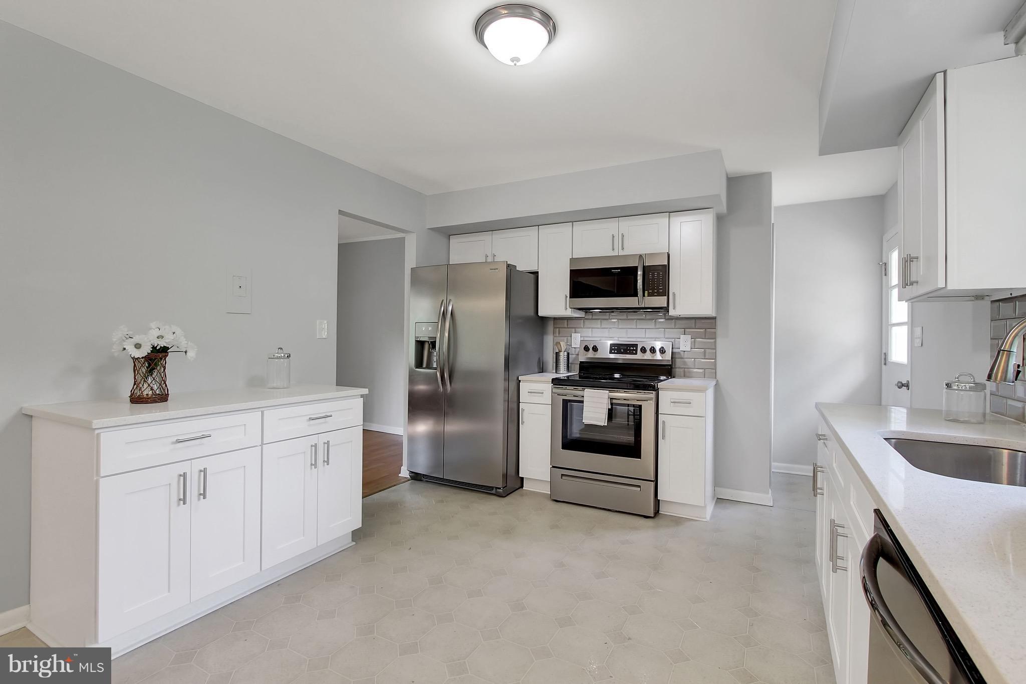 1905 Angleside Road Fallston, MD 21047 - Photo 5 of 25 a kitchen with granite countertop a sink and stainless steel appliances