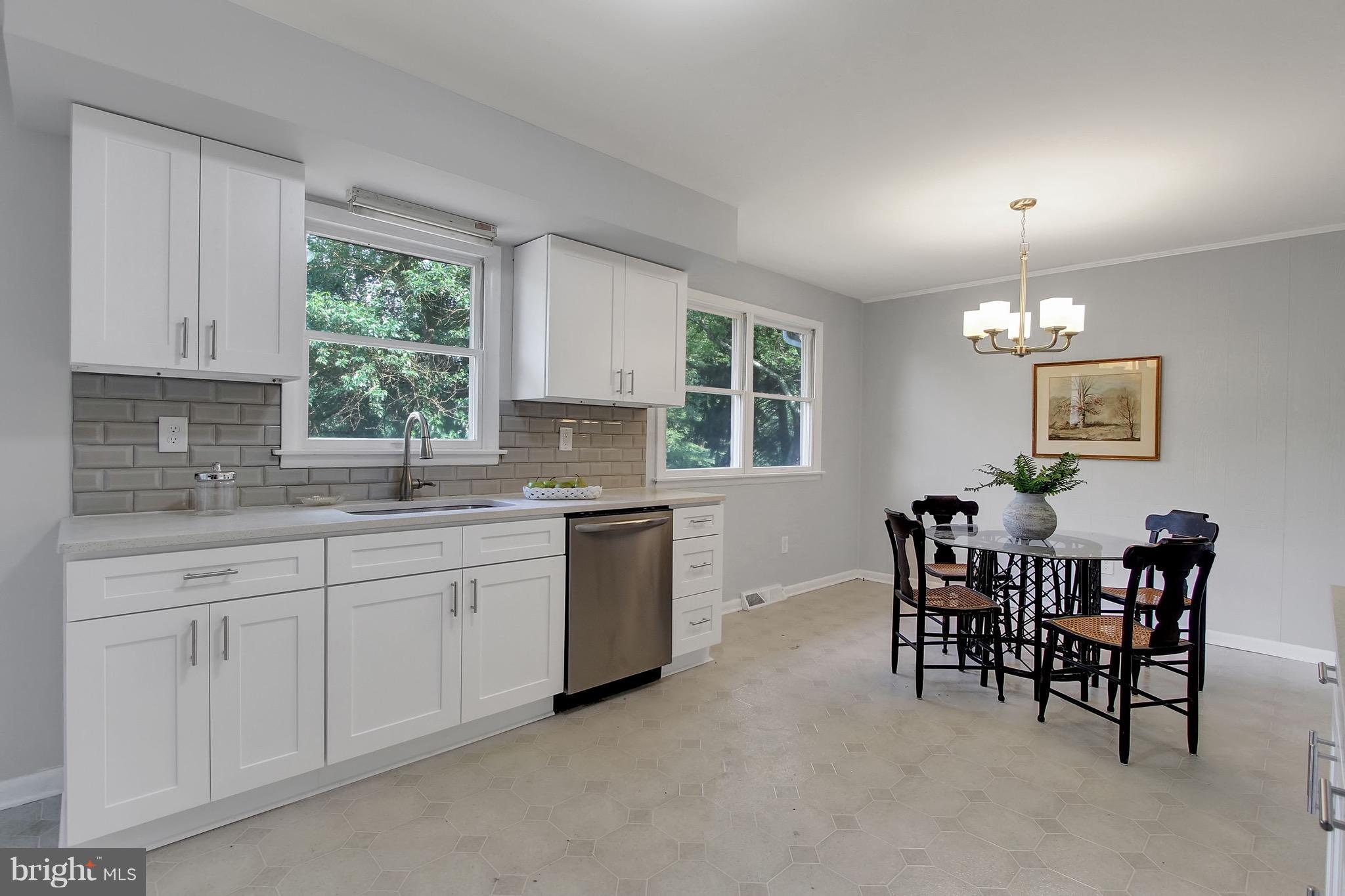 1905 Angleside Road Fallston, MD 21047 - Photo 7 of 25 a kitchen with granite countertop sink table and chairs