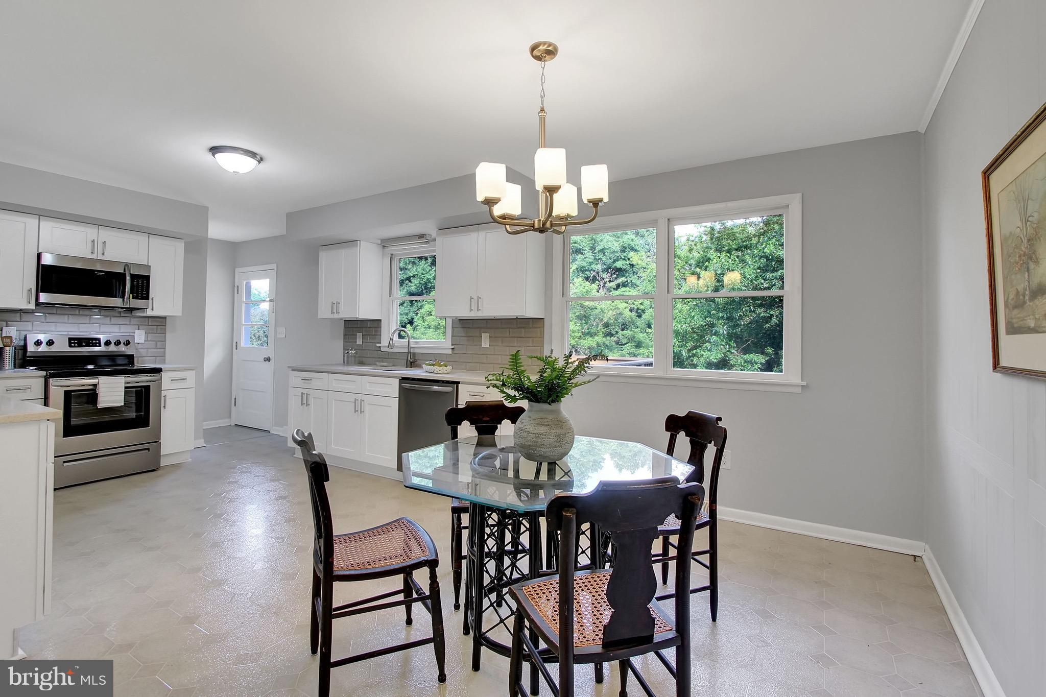 1905 Angleside Road Fallston, MD 21047 - Photo 9 of 25 a view of a dining room with furniture a chandelier and window