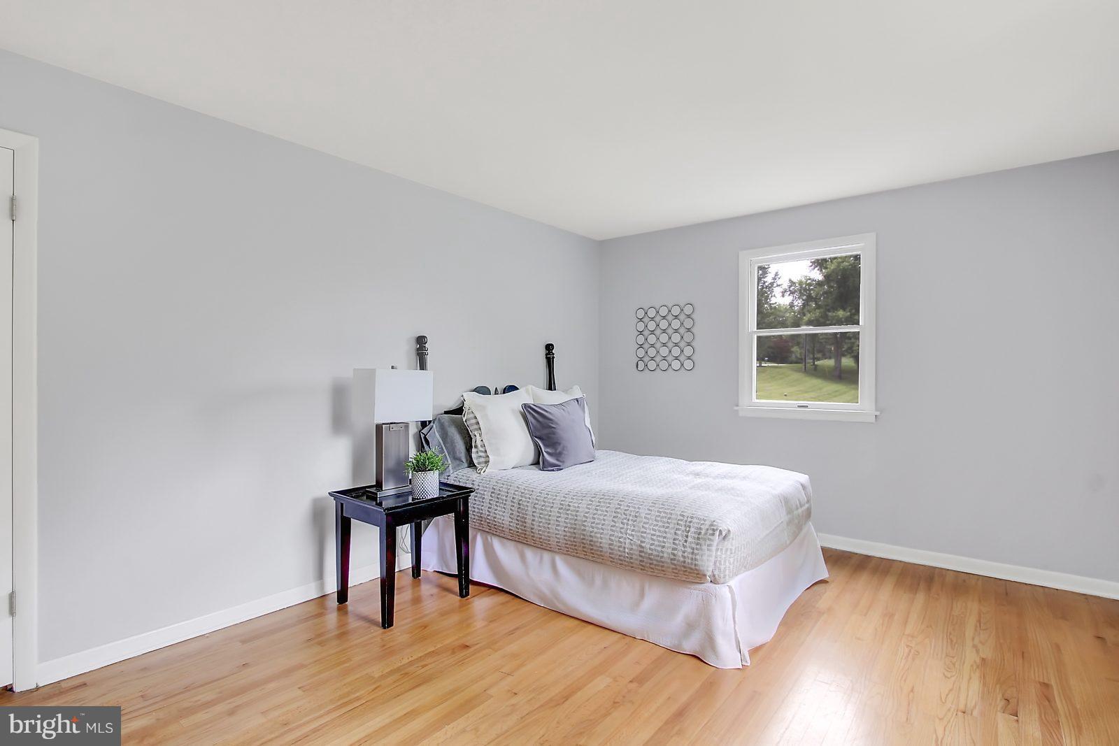 1905 Angleside Road Fallston, MD 21047 - Photo 10 of 25 a bedroom with a bed and a table