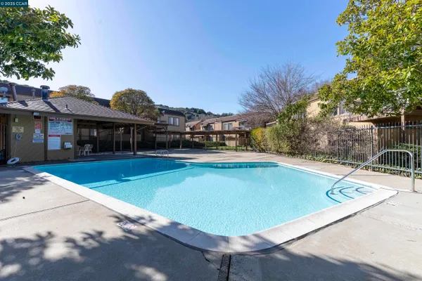 a view of a swimming pool with a lounge chairs
