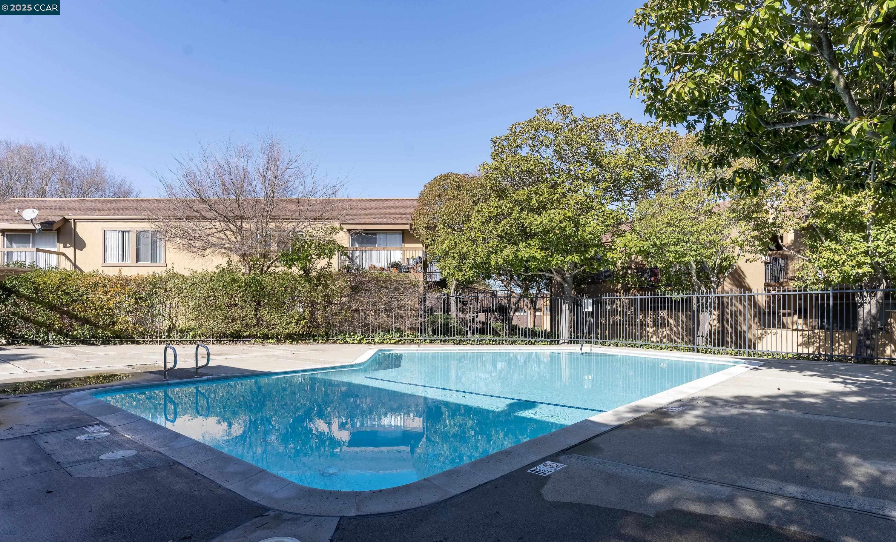 5305 Ridgeview Circle, Unit 8 El Sobrante, CA 94803 - Photo 14 of 18 a view of a swimming pool with a patio