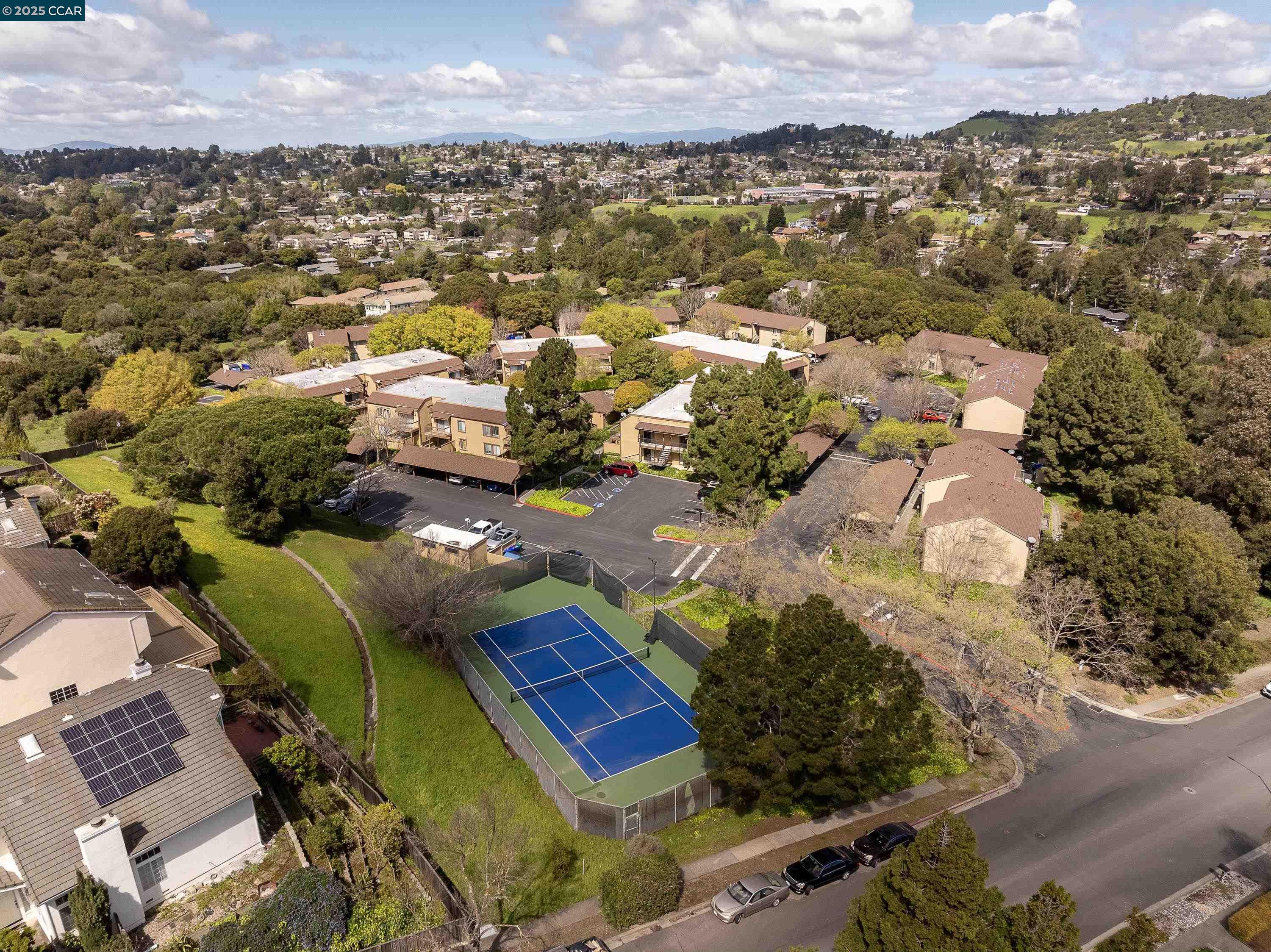5305 Ridgeview Circle, Unit 8 El Sobrante, CA 94803 - Photo 17 of 18 an aerial view of residential houses with outdoor space