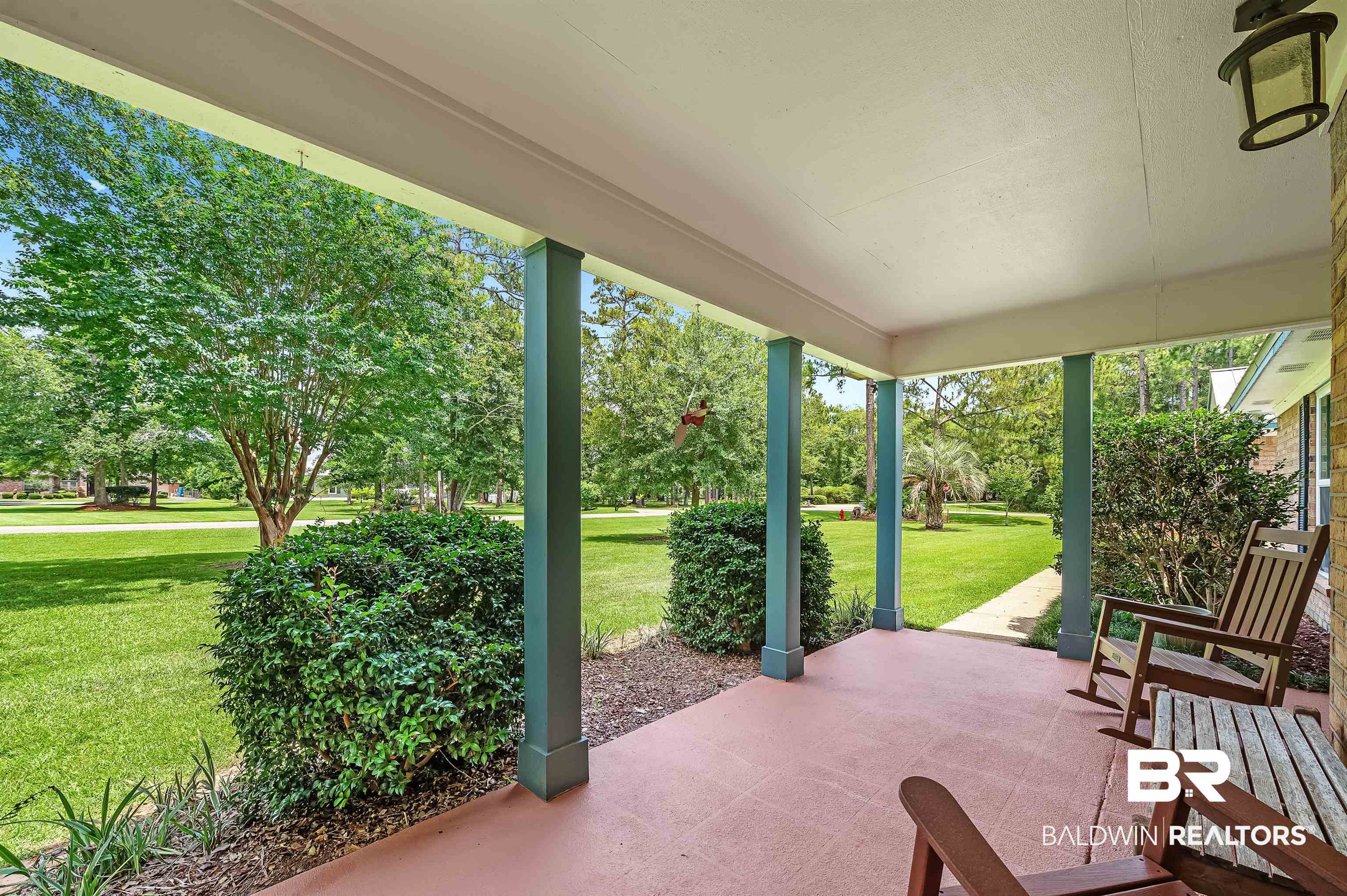24551 Wolf Bay Drive Foley, AL 36535 - Photo 7 of 59 Covered porch with a lawn