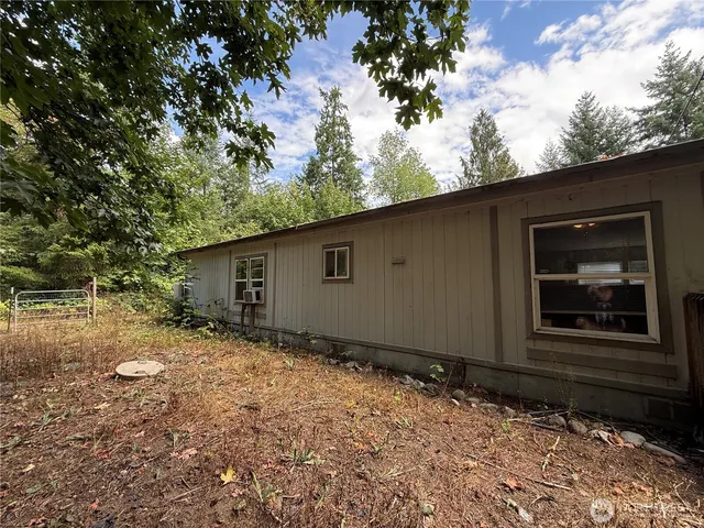 a backyard of a house with lots of green space