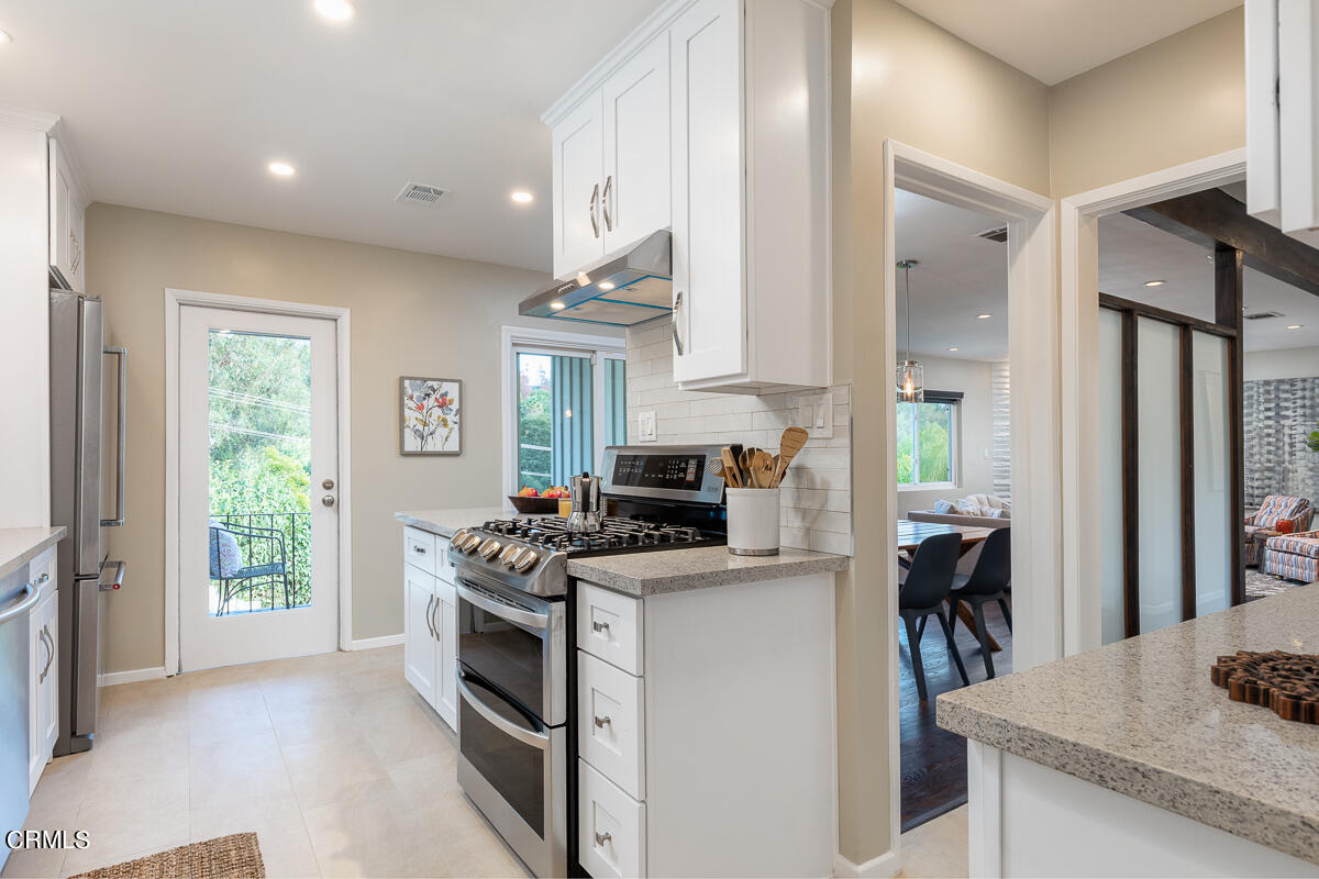 1376 Brixton Road Pasadena, CA 91105 - Photo 14 of 38 a kitchen with a stove a sink and a refrigerator